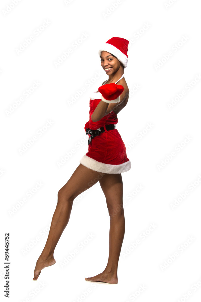 Fototapeta premium Christmas afro american woman wearing a santa hat smiling