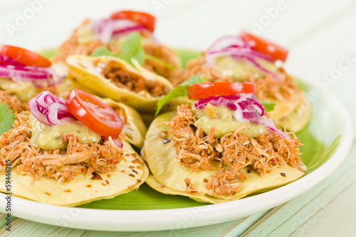 Panuchos - Mexican corn tortillas filled with refried beans
