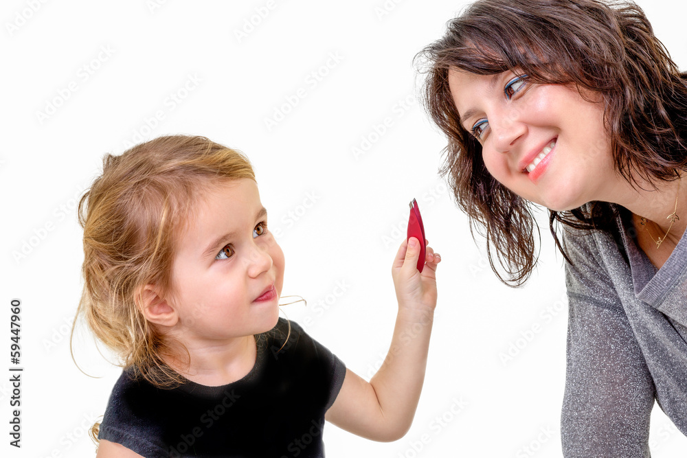 Cute little girl wants to apply her mothers makeup Cute little girl wants to apply her mothers makeup