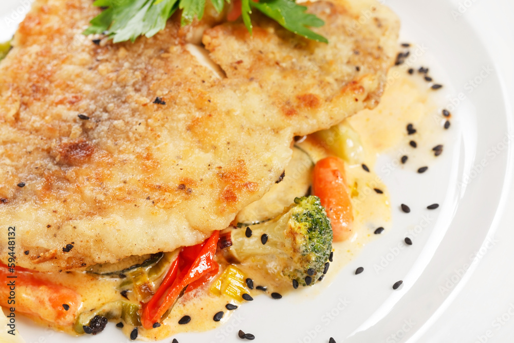 Grilled fish fillet with tomato and lemon Grilled fish fillet with tomato and lemon