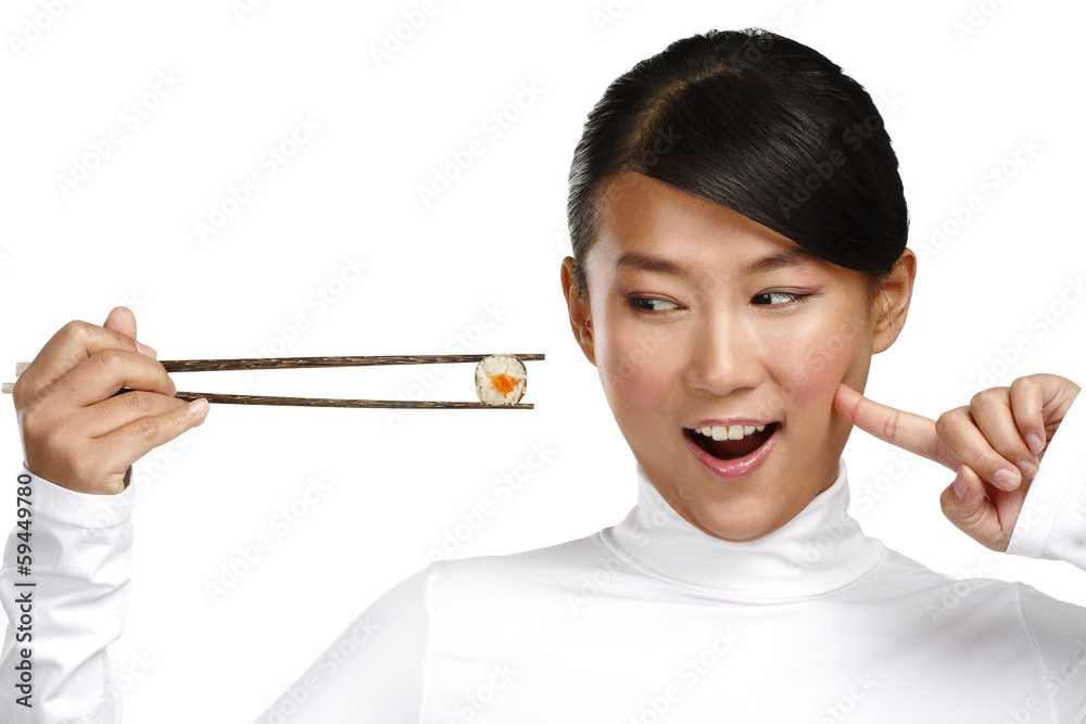 Chinese woman showing asian food using chopstick Chinese woman showing asian food using chopstick