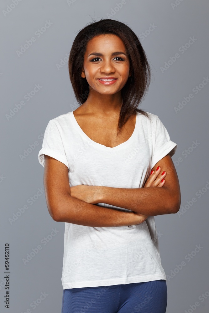 Cheerful young black woman isolated on grey background Cheerful young black woman isolated on grey background