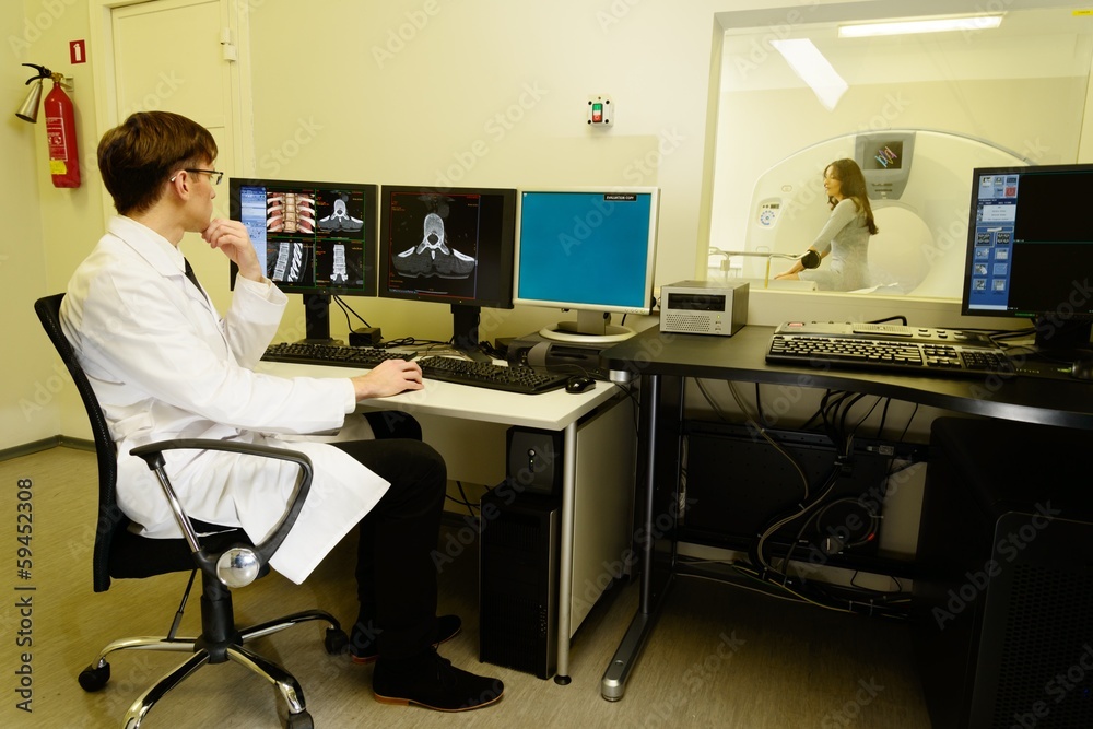 Doctor with woman patient at the computed tomography Doctor with woman patient at the computed tomography
