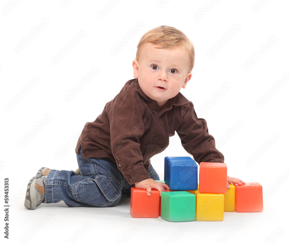 Little kid playing with toy blocks. Little kid playing with toy blocks.
