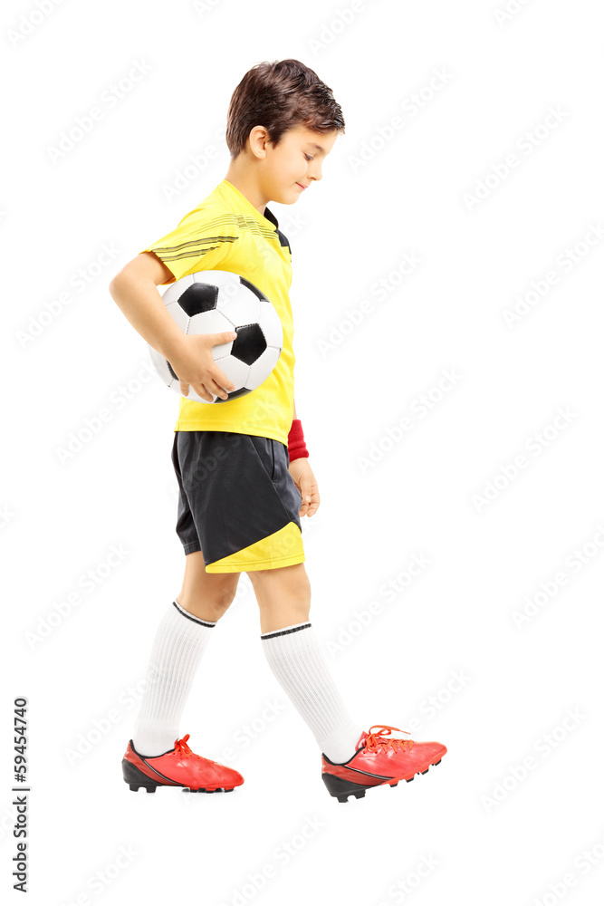 Full length portrait of a sad kid in sportswear posing with a ba