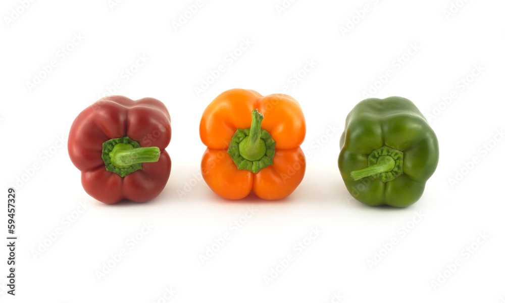 Three whole color ripe bell peppers in-line isolated close up Three whole color ripe bell peppers in-line isolated close up