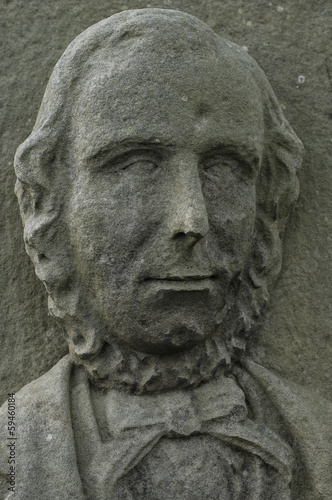 Face of an 18th century English lord engraved on stone