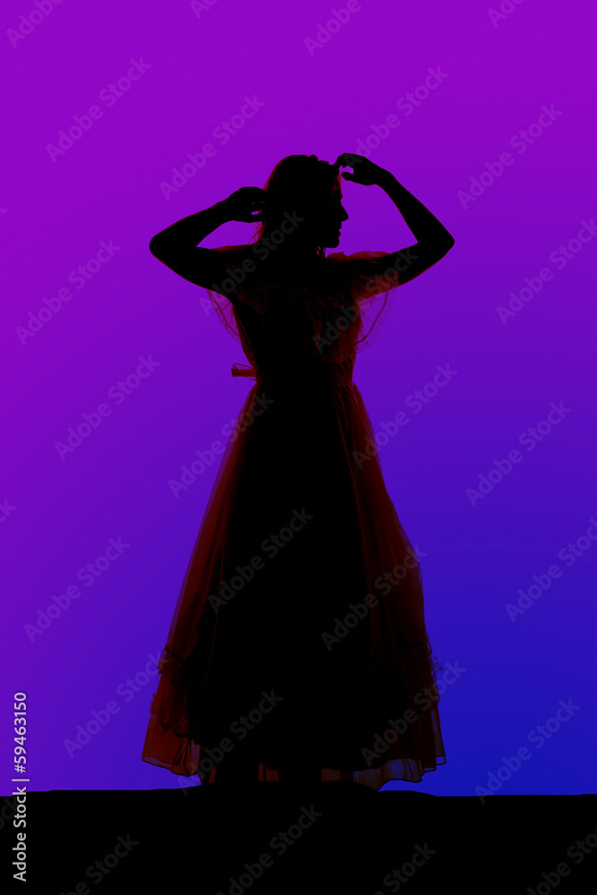 Silhouette woman dress arms by head