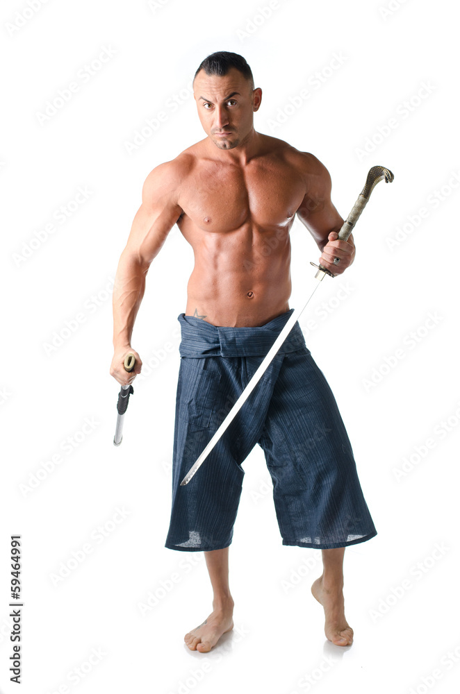 Muscular shirtless man with traditional martial arts sword Muscular shirtless man with traditional martial arts sword