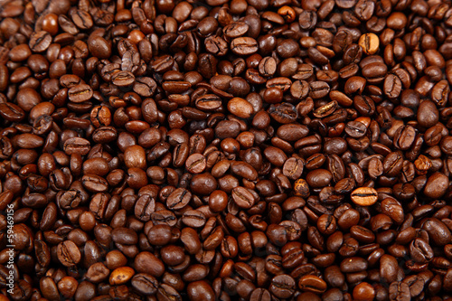 Roasted coffee beans as a background.