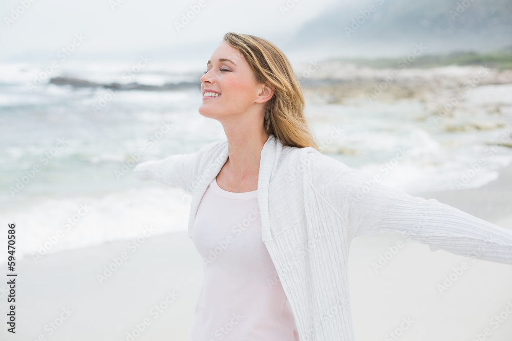 Casual young woman with eyes closed at beach Casual young woman with eyes closed at beach