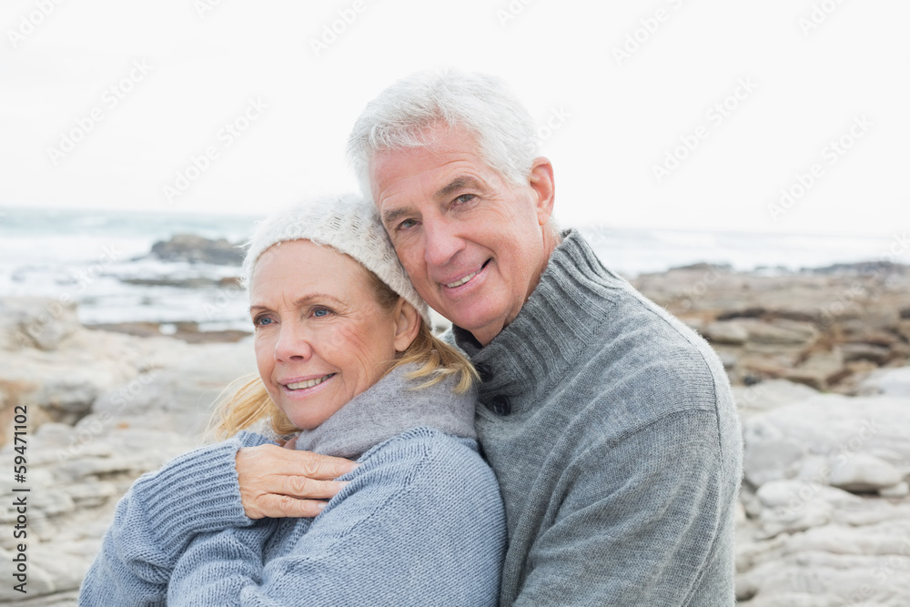 Romantic senior couple on rocky beach