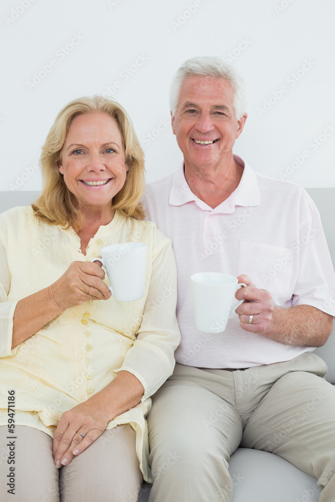 Senior couple with coffee cups at home Senior couple with coffee cups at home