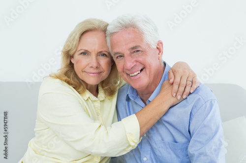 Romantic relaxed senior couple at home