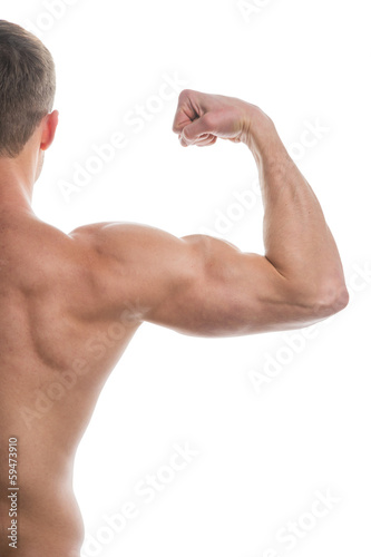 Close up of muscular arm lifting.