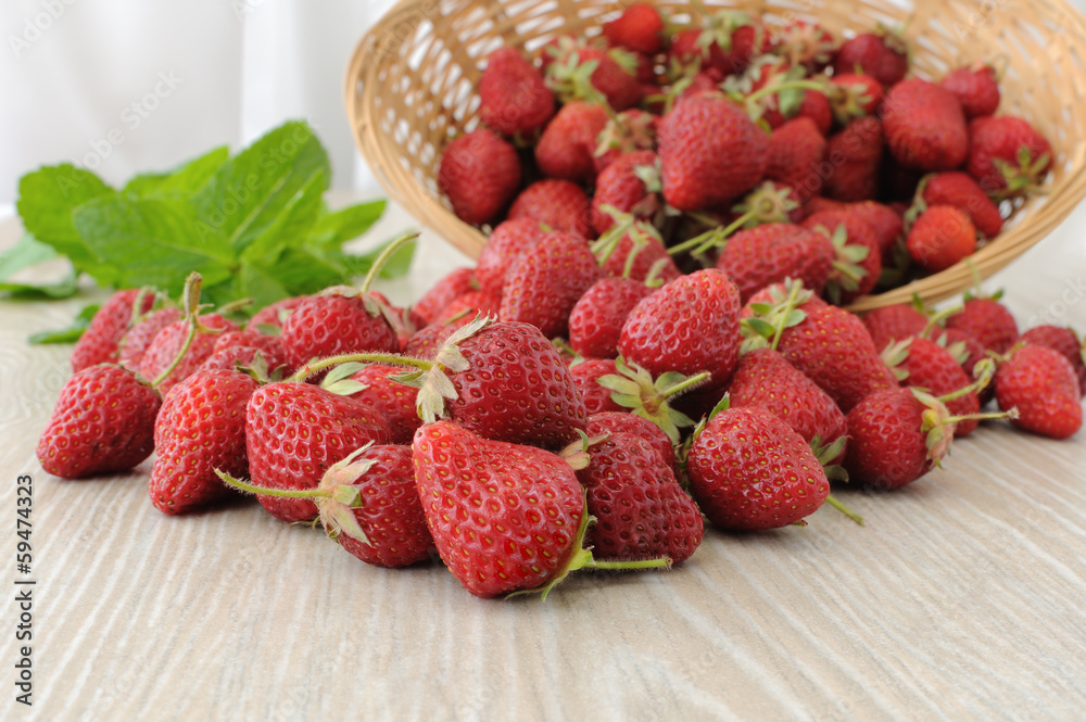 Baskets of strawberries sprinkled on the table Baskets of strawberries sprinkled on the table