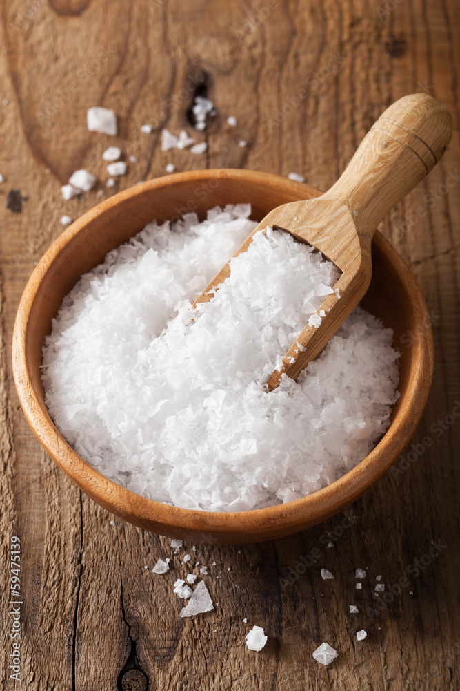 sea salt in wooden bowl and scoop