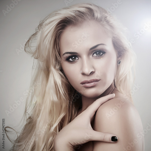 portrait of Beautiful blond woman. light background. beauty girl