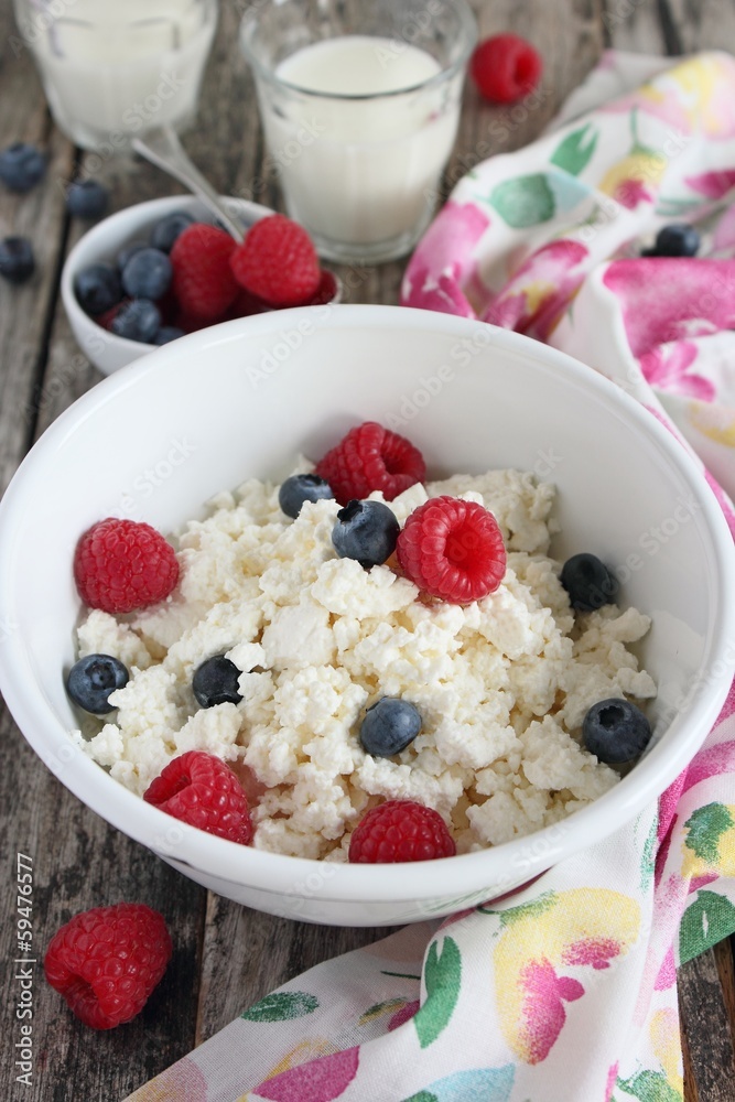 Fresh cottege cheese with berries and milk. Fresh cottege cheese with berries and milk.