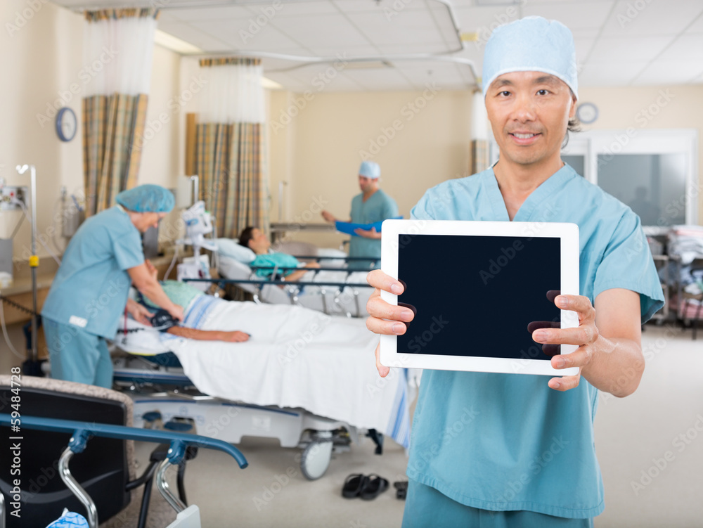 Nurse Showing Digital Tablet In Ward