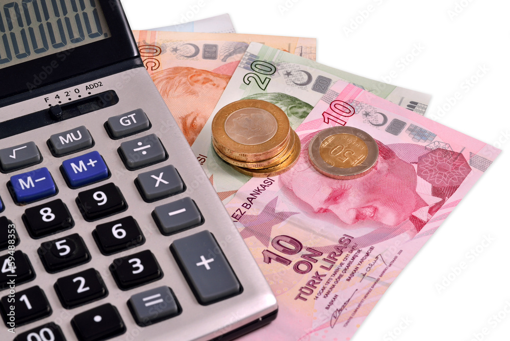 Turkish money and calculating machine on white background Turkish money and calculating machine on white background