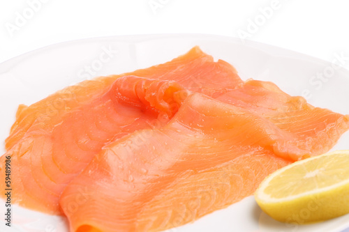 Slices of smoked salmon with lemon
