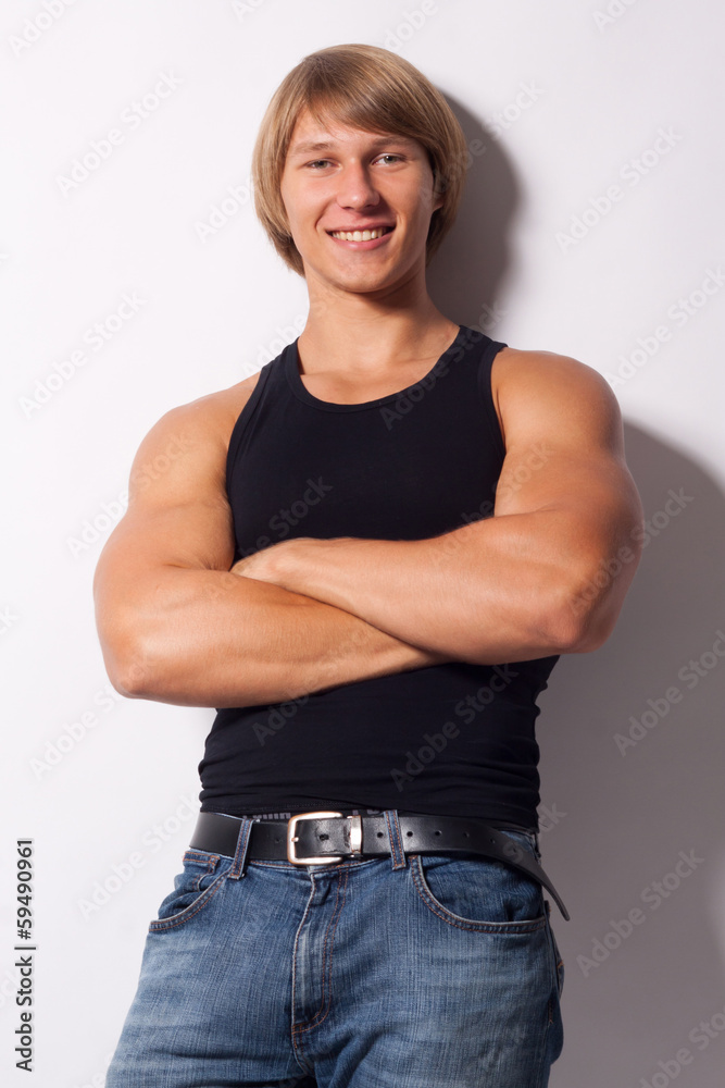Wunschmotiv: Muscled male model posing on white #59490961