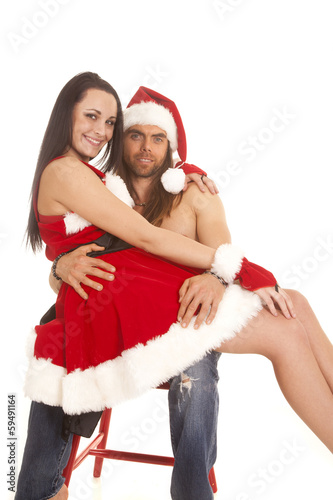 santa couple sit on lap smile