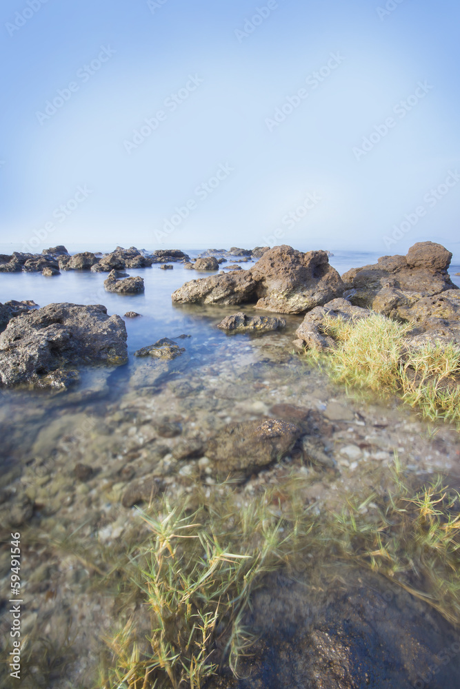 Sea and rocky coast in the morning