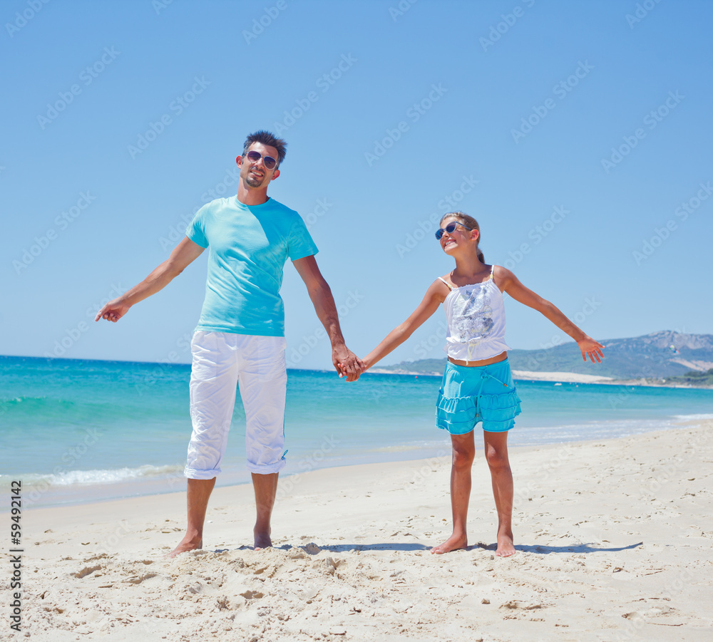 Father and daughter on the beach