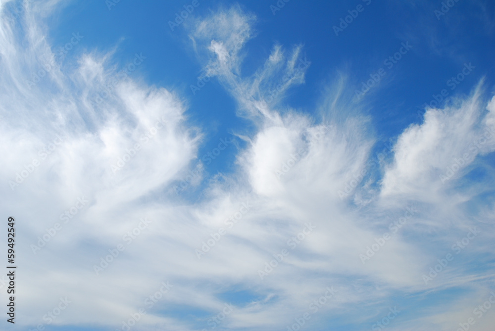 White windy clouds with blue sky background White windy clouds with blue sky background