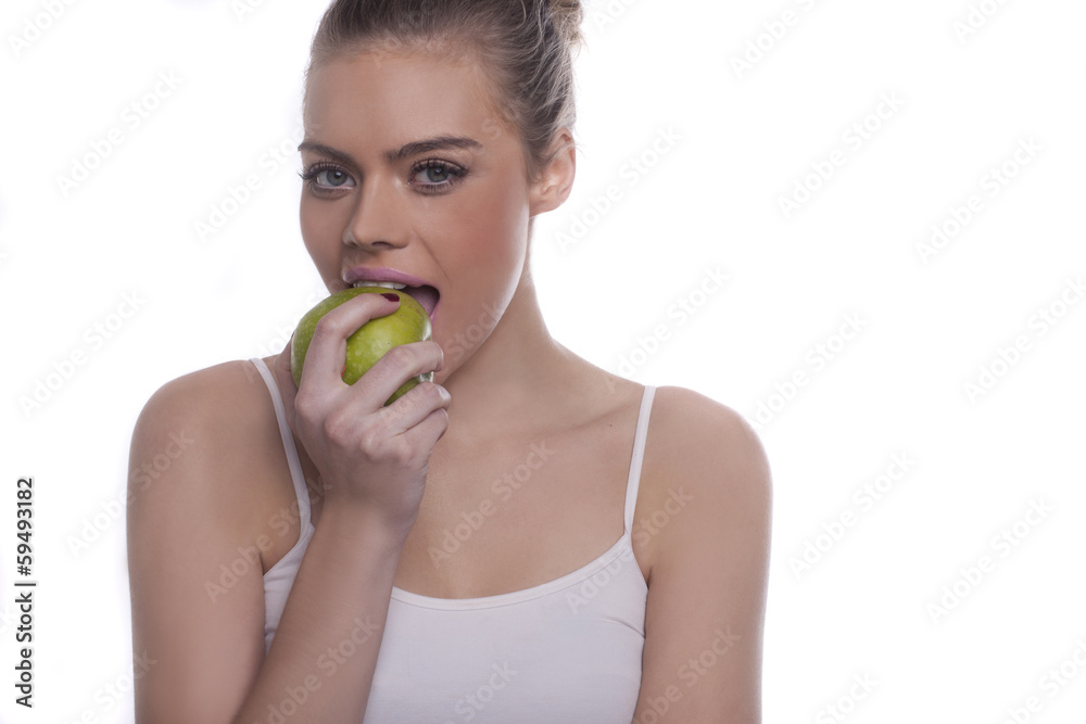 Beautiful healthy woman enjoying a green apple Beautiful healthy woman enjoying a green apple