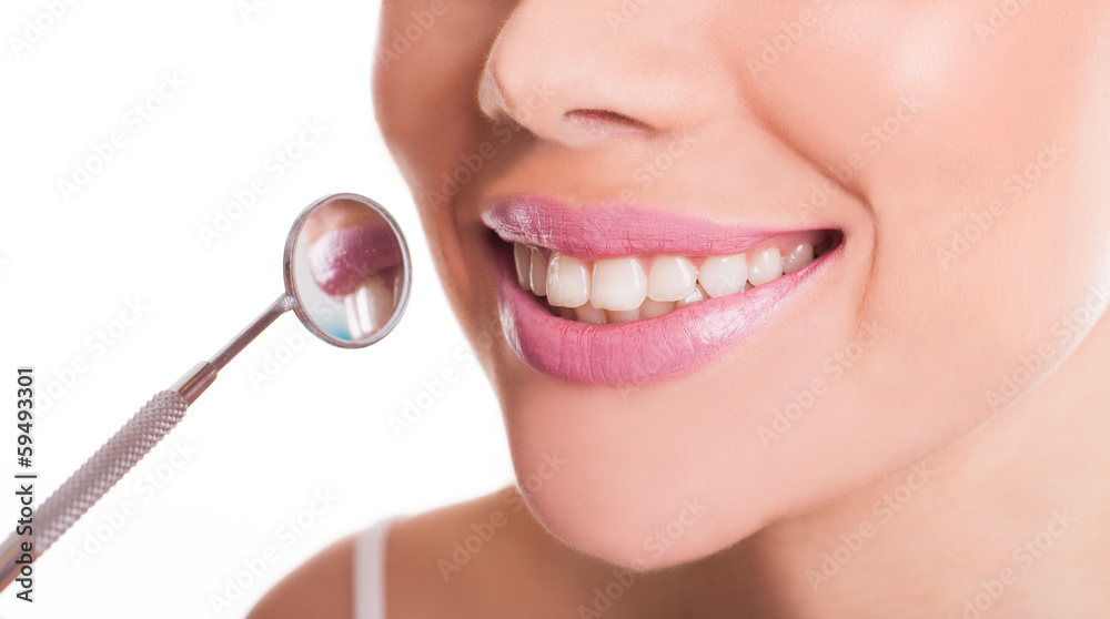 Fototapeta premium Smiling mouth of a woman showing her healthy teeth
