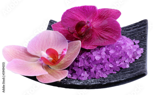 Beautiful blooming orchid flowers  and heap of sea salt