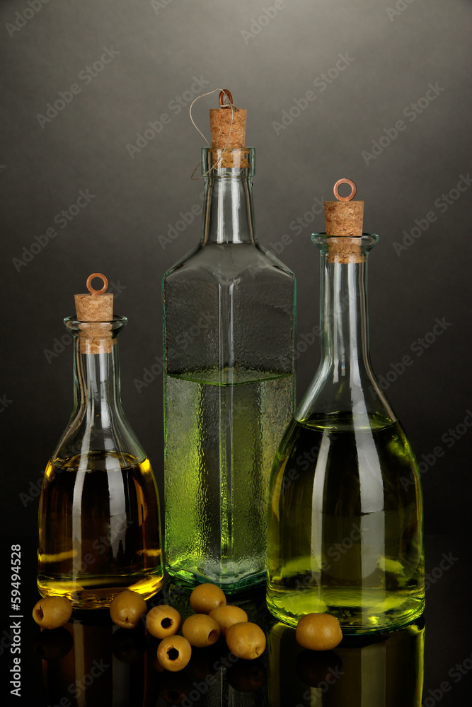 Original glass bottles with oil isolated on black