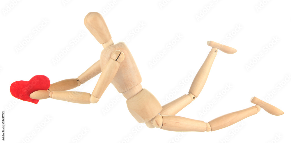 Wooden mannequin holding red heart isolated on white Wooden mannequin holding red heart isolated on white