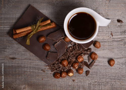 Pieces of dark chocolate and black coffee photo