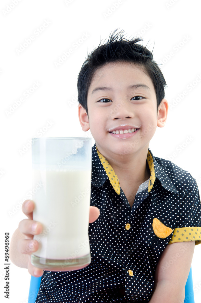 Portrait of Little asian boy drinking a glass of milk Portrait of Little asian boy drinking a glass of milk