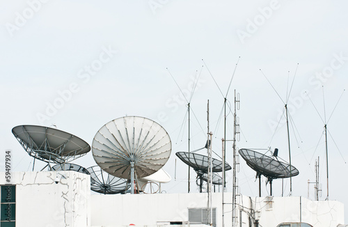 satellite dish and antenna on building