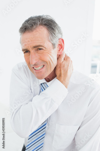 Mature man suffering from neck pain