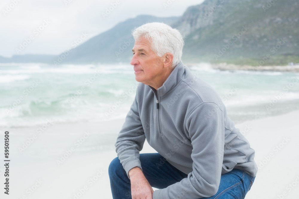Side view of a senior man relaxing at beach