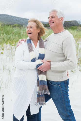 Cheerful romantic senior couple at beach