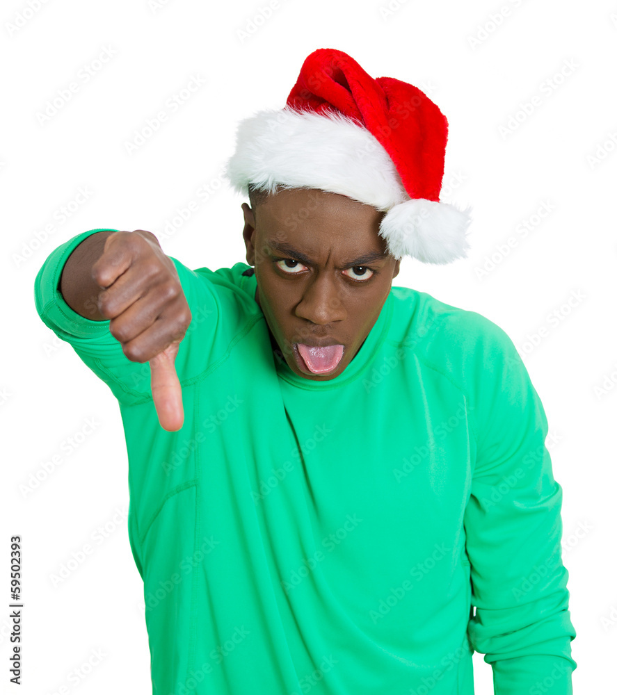 Grumpy, unhappy Christmas man giving thumbs down Grumpy, unhappy Christmas man giving thumbs down