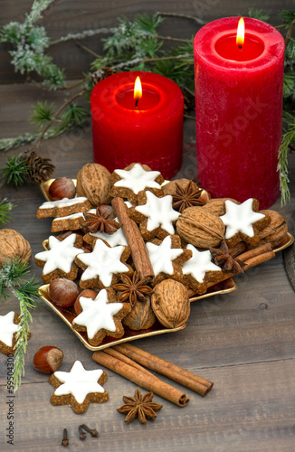 Fototapeta Naklejka Na Ścianę i Meble -  cinnamon cookies, nuts and spieces with christmas decoration