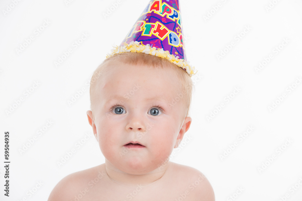 Portrait of cute funny baby in birthday party hat. Portrait of cute funny baby in birthday party hat.