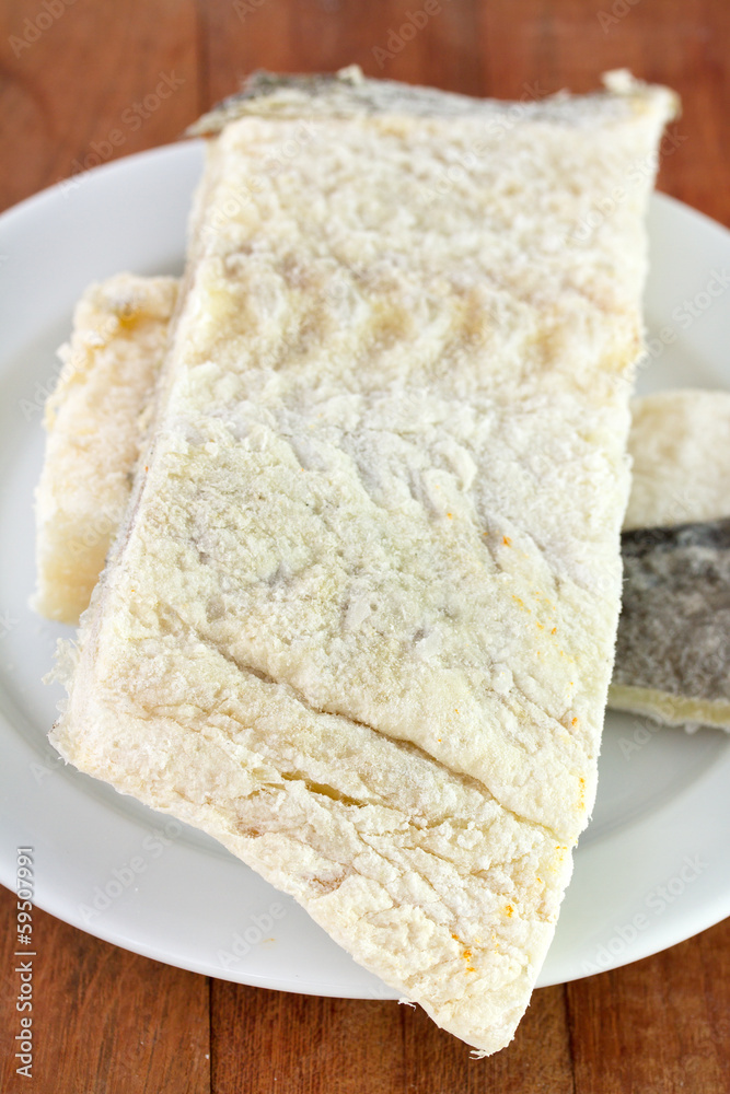 salted cod fish on white plate salted cod fish on white plate