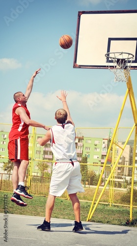 Two basketball players on the court