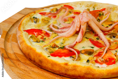 Appetizing pizza with an octopus seafood on a wooden trayisolate