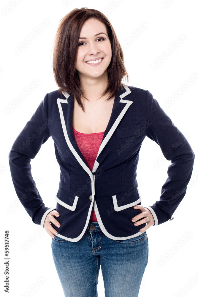 Cheerful young woman posing confidently Cheerful young woman posing confidently
