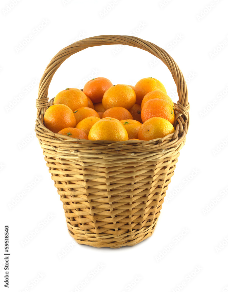 Many orange tangerines in high brown wicker basket isolated Many orange tangerines in high brown wicker basket isolated